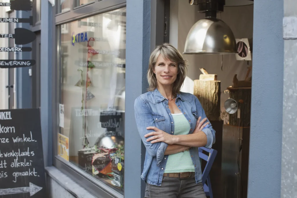 Independent shop owner standing in the doorway of her store